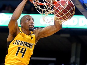 Marcus Capers of the Lightning gets an easy dunk off a steal by teammate Kirk Williams Jr during the Lightning's season opener at Budweiser Gardens on Sunday Nov. 18, 2018. (Mike Hensen/The London Free Press)
