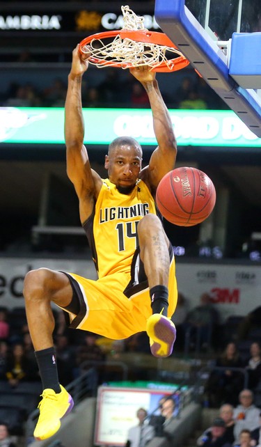 Marcus Capers of the Lightning gets an easy dunk off a steal by teammate Kirk Williams Jr during the Lightning's season opener at Budweiser Gardens on Sunday Nov. 18, 2018. (Mike Hensen/The London Free Press)