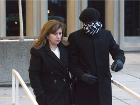 Miguel Chacon-Perez is escorted by a supporter after leaving court in London on Monday November 19, 2018. (Derek Ruttan/The London Free Press)