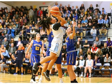 Lucas's Avarie Thomas goes up for two late in the quarterfinal against Brantford Collegiate at home Friday 2018 during the OFSAA AAA tournament. Lucas led early, fell behind in the second and third quarter and pulled out a squeaker winning 55-53 and moving on to the final four. (Mike Hensen/The London Free Press)