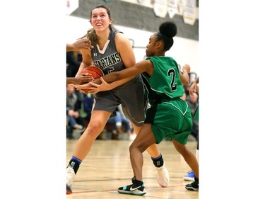 Emma Gentile of the Mother Teresa Spartans gets fouled as a player from Ajax's Dennis O'Connor gets called for reaching in during their OFSAA AA quarterfinal game at John Paul II on Friday. The Spartans will have home floor for the semifinal at 10:30 a.m. Saturday but it will be against top-seeded Wallaceburg, who beat Theriauly 68-47 in the quarters. (Mike Hensen/The London Free Press)