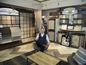 John Verhey, owner of SacWall Flooring Centres, relaxes amid the myriad of samples in his Wharncliffe Road store. Technology has expanded flooring option during SacWal's 30 years in business, he said. (Derek Ruttan/The London Free Press)