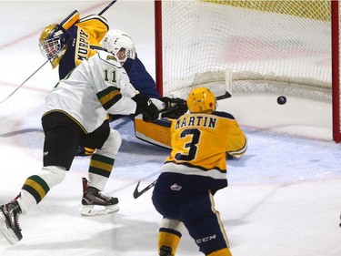 Connor McMichael of the Knights lifts a backhand past Erie Otters goalie Daniel Murphy duringthe first period of their OHL game at Budweiser Gardens in London on Friday night. (Mike Hensen/The London Free Press)