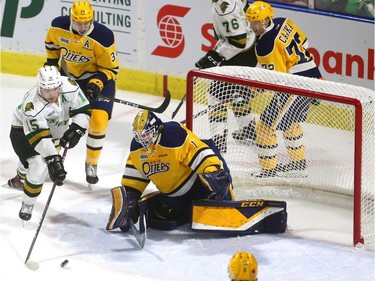 Cole Tymkin of the Knights pulls the puck out front of Erie Otters goalie Daniel Murphy before burying it for his second goal of the first period, making the score 3-1 at Budweiser Gardens in London on Friday night.  (Mike Hensen/The London Free Press)