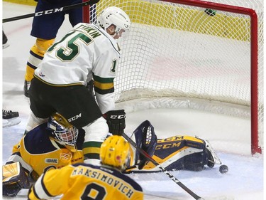 Cole Tymkin of the Knights gets the puck around the pad of Erie Otters goalie Daniel Murphy and buries it for his second goal of the first period, making the score 3-1 at Budweiser Gardens in London on Friday night. (Mike Hensen/The London Free Press)