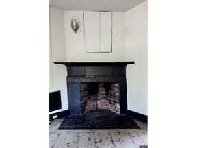 This 2017 photo provided by Sarah Cole shows the central fireplace in the kitchen of the James Blake House in Boston, which dates back to 1661. Cole is restoring the home's interior to make it more livable for current caretaker Barbara Kurze. (Sarah Cole via AP)