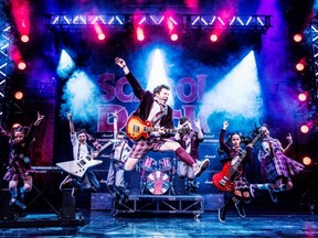 School of Rock at the Ed Mirvish Theatre has a kids' rock band playing instruments on stage.
Photo by Evan Zimmerman/MurphyMade