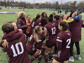 The Ottawa Gee-Gees celebrate after defeating the Western Mustangs 1-0 in the Ontario University Athletics women's soccer championship game Sunday at Western. (Paul Vanderhoeven/The London Free Press)
