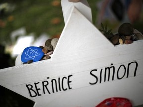 A memorial to Bernice Simon is part of a makeshift memorial outside the Tree of Life Synagogue in Pittsburgh, Penn. The violence has brought people of all faiths together to denounce the rhetoric that feeds hate. (Associated Press)