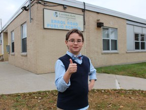Sarnia's Liam Henderson, 11, stands outside Errol Road Public School where he's in Grade 6. Liam is a contestant in the television show Canada's Smartest Person Junior, premiering Nov. 14 on CBC.
