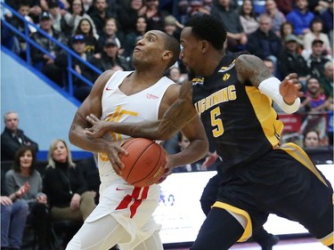 Georges Serresse, of the Sudbury Five, drives past Kevin Ware, of the London Lightning, during basketball action at the Sudbury community arena in Sudbury on Thursday Nov. 22. John Lappa/Postmedia Network