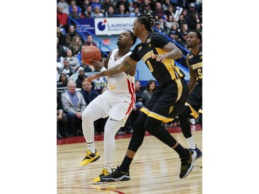 Jaylen Bland, of the Sudbury Five, drives past Mo Bolden, of the London Lightning, during basketball action at the Sudbury community arena in Sudbury on Thursday Nov. 22. John Lappa/Postmedia Network