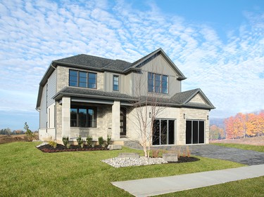 The Walnut is a beautifully designed 2,728 sq. ft. home. A front den looks out to a large front porch and the foyer of the home leads to a formal dining room, as well as a spacious great room and kitchen.