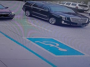 Police say this black SUV may have been used by thieves who stole $100,000 worth of products from an Ingersoll jewelry store on Saturday. (OPP supplied photo)
