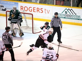 Andrew Perrott and Zach Roberts square off in the first period of the Owen Sound Attack and London Knights Saturday night contest at the Harry Lumley Bayshore Community Centre in Owen Sound. (Greg Cowan/The Sun Times)