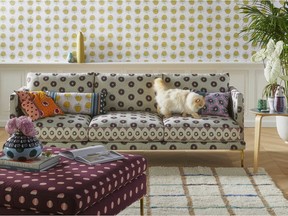 Featuring a geometric print and cast iron legs, the Linde sofa, a collaborative collection with luxury lifestyle brand SUNO, has a chic yet relaxed midmod Italian profile. (Anthropologie via The Associated Press)