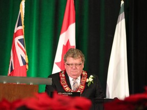 London's 64th Mayor Ed Holder sits down after receiving the chain of office from former MP Glen Pearson during the inaugural council meeting at the London Convention Centre on Dec. 3, 2018. (MEGAN STACEY/The London Free Press)