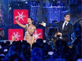 Lea Michele and Joey McIntyre of NKOTB perform "Baby, It's Cold Outside" during a taping of "The Wonderful World of Disney: Magical Holiday Celebration" at Sleeping Beauty's Castle at Walt Disneyland on November 14, 2017 in Anaheim, California.