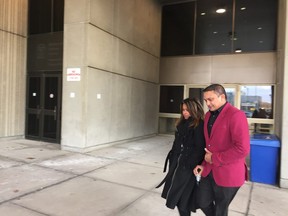 Jaimini Panday and his wife leave the London courthouse after he finished his testimony for the defence at the second-degree murder trial of Miguel Chacon-Perez. He is the only witness who says he saw a man with no shirt, not Chacon-Perez, who had a knife in his hand and who punched victim Chad Robinson in the chest. (JANE SIMS, The London Free Press)