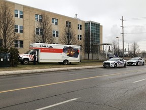 London police are seen outside the Mission Services of London building on York Street where a U-Haul truck was left abandoned Sunday morning. (JONATHAN JUHA, The London Free Press)