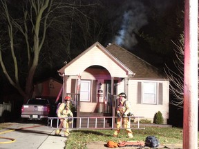 Fire crews responded to a house fire at 16 Eastman Ave. around 6:30 p.m. Wednesday. Everyone inside the home made it out safely after neighbours alerted them to the fire, but a fire district chief said there was "significant" damage to the back of the house, likely exceeding $50,000. The blaze may have started outside or in the attic. (MEGAN STACEY/The London Free Press)