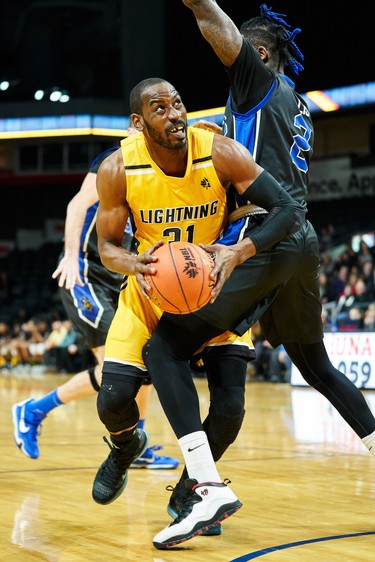 London's Kirk Williams Jr tries to drive past Kitchener's Malcolm Duvivier during the first quarter of the Lightning NBL game against the Kitchener Titans in London, Ontario, Friday,  December 21, 2018.
The London Free Press/ Geoff Robins