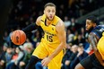 London Lightning's Garrett Williamson drives the lane during the first quarter of the NBL game against the Kitchener Titans in London on Friday, December 21, 2018. (Geoff Robins, Special to The London Free Press)