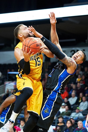 London's Garrett Williamson collides with Kitchener's Joel Friesen during the Lightning's NBL game against the Kitchener Titans in London, Ontario, Friday,  December 21, 2018.
The London Free Press/ Geoff Robins