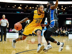 London's Jelan Kendrick tries to drive past Kitchener-Waterloo's Damon Lynn during the Lightning's NBL game in London on Friday,  December 21, 2018.
(Geoff Robins file photo)