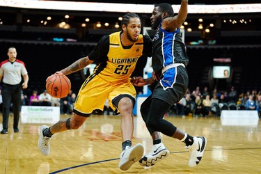 London's Jelan Kendrick tries to drive past Kitchener's Damon Lynn during the Lightning's NBL game against the Kitchener Titans in London, Ontario, Friday,  December 21, 2018.
The London Free Press/ Geoff Robins