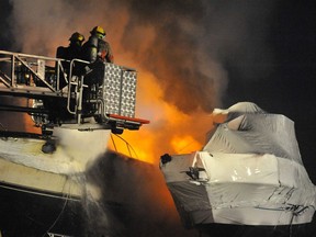 Norfolk firefighters battled a blaze at Team Marine on Highway 24 south of Simcoe on Sunday. Several boats were destroyed or damaged.