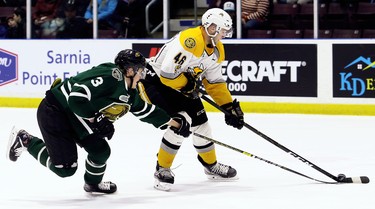 Sarnia Sting's Hugo Leufvenius (46) drives to the net while being checked by London Knights' Adam Boqvist (3) in the first period at Progressive Auto Sales Arena in Sarnia, Ont., on Wednesday, Dec. 12, 2018. (Mark Malone/Chatham Daily News/Postmedia Network)