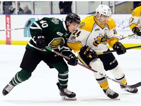 London Knights' Antonio Stranges (40) battles Sarnia Sting's Marko Jakovljevic (24) in the second period at Progressive Auto Sales Arena in Sarnia, Ont., on Wednesday, Dec. 12, 2018. (Mark Malone/Postmedia Network)