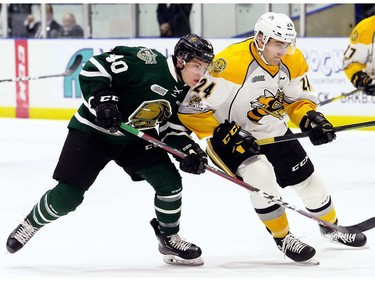 London Knights' Antonio Stranges (40) battles Sarnia Sting's Marko Jakovljevic (24) in the second period at Progressive Auto Sales Arena in Sarnia, Ont., on Wednesday, Dec. 12, 2018. (Mark Malone/Chatham Daily News/Postmedia Network)