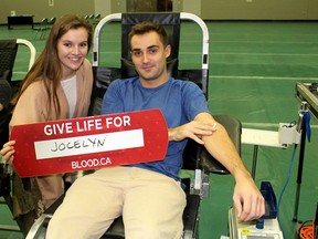 Hilary Pomajba, 19, and Adriano Bernardi, 21, were among the many friends who took part in a blood donor clinic in honour of Jocelyn McGlynn, 21, who is battling leukemia, that was held at the St. Clair College HealthPlex in Chatham on Saturday. (Ellwood Shreve/Chatham Daily News)