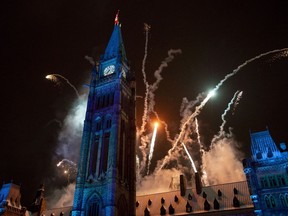 Pyrotechnics explode above Centre Block on Parliament Hill during the Christmas Lights Across Canada illumination ceremony in early December. In january, MPs and senators will move out of the Centre Block so renovations can begin.