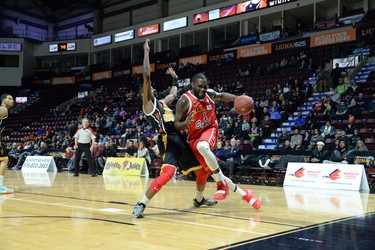 Windsor Express player Juan Pattillo battles London Lightnings Kirk Williams Jr. along the baseline during their National Basketball League of Canada game in Windsor on Friday, Dec. 28, 2018. (TAYLOR CAMPBELL/Postmedia News)