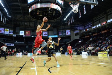 Windsor Expresss Ryan Anderson beats Xavier Moon of the London Lightning to sink a layup in on his home court during their National Basketball League of Canada game in Windsor on Friday, Dec. 28, 2018. (TAYLOR CAMPBELL/Postmedia News)