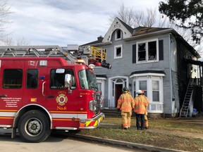 Firefighters at the scene of house fire on St. Andrew Street between Oxford Street and Empress Avenue, close to Wharncliffe Road. (JONATHAN JUHA, The London Free Press)