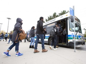 People board an LTC bus at Masonville Place. (File photo)