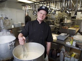 Chef Len Devost makes potato, cheddar and ham soup at Mission Services of London on Wednesday. The agency feeds between 100 and 150 people, three times a day. (Derek Ruttan/The London Free Press)