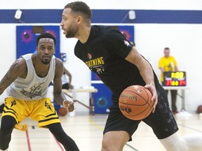 Kevin Ware Jr. covers ball carrier Garrett Williamson during a London Lightning team scrimmage at the YMCA practice facility in London. (DEREK RUTTAN, The London Free Press)