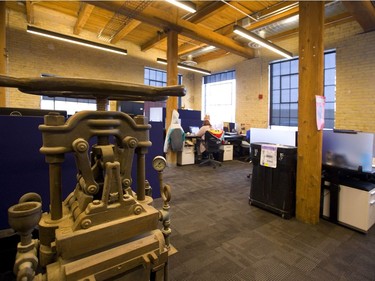 Info-Tech Research Group has gutted and renovated a group of old buildings on Talbot Street between King and York streets in London. The 150-year-old buildings are now a mix of 21st-century technology and bricks and beams of the original construction. (Mike Hensen/The London Free Press)