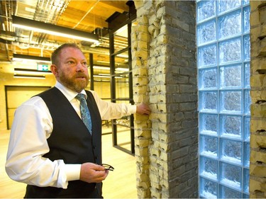 Joel McLean, founder of Info-Tech Research Group, has had a group of old buildings on Talbot Street between King and York streets in London gutted and renovated. The 150-year-old buildings are now a mixture of 21st-century technology andthe  bricks and beams of the original construction. (Mike Hensen/The London Free Press)