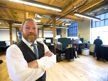 Joel McLean, founder of Info-Tech Research Group, has had a group of old buildings on Talbot Street between King and York streets in London gutted and renovated. The 150-year-old buildings are now a mixture of 21st-century technology andthe  bricks and beams of the original construction. (Mike Hensen/The London Free Press)