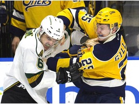 Riley Coome of the London Knights dukes it out with Marcus Gillard of the Erie Otters in the second period of their Ontario Hockey League game Sunday at Budweiser Gardens after Coome came to the defence of rookie teammate Luke Evangelista. (Derek Ruttan/The London Free Press)