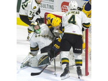Erie Otters forward Kyle Maksimovich crashes the net and ends up behind London Knights goalie Joseph Raaymakers in the second period of their game at Budweiser Gardens on Sunday. 

Derek Ruttan/The London Free Press/Postmedia Network
