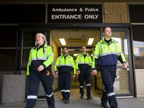 Paramedics Cassidy Gosling, Jason DeHoey, Patrick Chouinard and Dominik Palys leave the Victoria Hospital emergency department. Middlesex-London Paramedic services will be adding two more ambulances to their fleet following a pilot project testing the impact of the additional crews.  Photograph taken on Tuesday December 25, 2018.  Mike Hensen/The London Free Press/Postmedia Network
