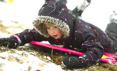 Presley Mathies, 5 finds herself sliding backwards down the hill at Doidge Park on Sunday December 30, 2018. Mathies and her parents and friends were enjoying the small amount of snow that fell overnight on the city.
Mike Hensen/The London Free Press/Postmedia Network