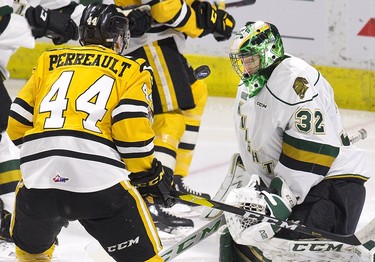 London Knights goalie Joseph Raaymakers makes a save in front of Sarnia Sting forward Jacob Perreault  during their OHL game in London, Ont. on Monday December 31, 2018. Derek Ruttan/The London Free Press/Postmedia Network